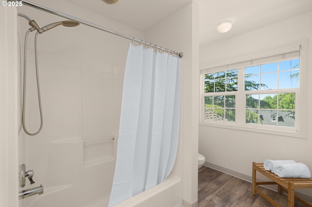 342 NW 84th Pl, Portland, OR 97229 - bathroom featuring shower / bath combo with shower curtain, wood finished floors, baseboards, and toilet