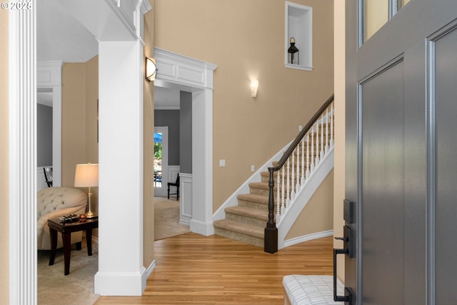342 NW 84th Pl, Portland, OR 97229 - foyer entrance featuring light wood-style flooring, a towering ceiling, stairs, and baseboards