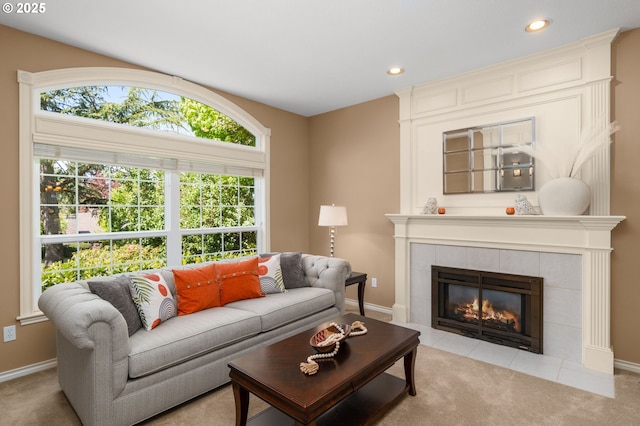 342 NW 84th Pl, Portland, OR 97229 - carpeted living room with a tiled fireplace, recessed lighting, and baseboards