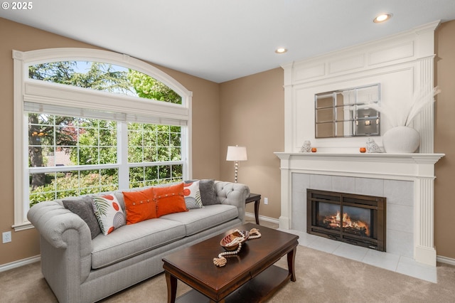 342 NW 84th Pl, Portland, OR 97229 - living room with a tiled fireplace, recessed lighting, and light colored carpet