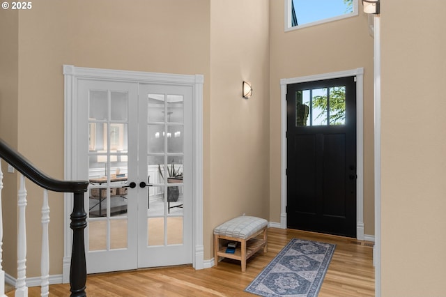 342 NW 84th Pl, Portland, OR 97229 - entryway featuring wood finished floors, a towering ceiling, and french doors