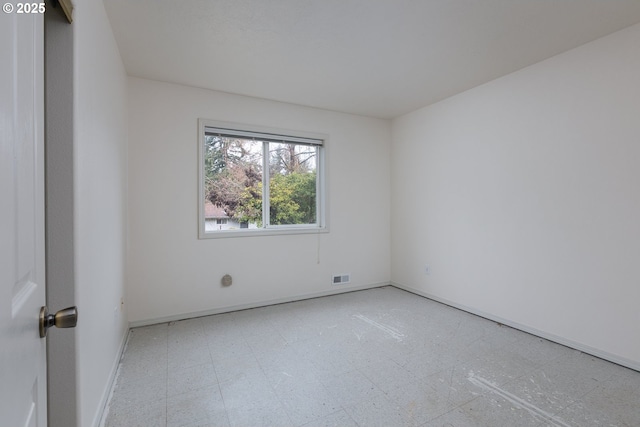 unfurnished room featuring visible vents and tile patterned floors