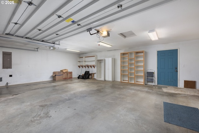 garage with electric panel and a garage door opener