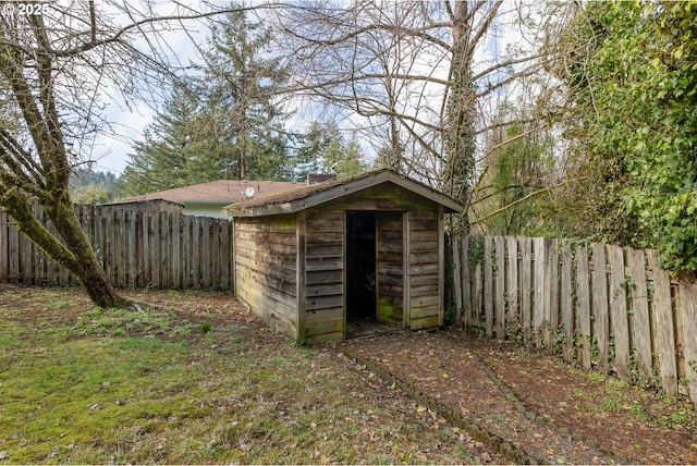 view of shed with a fenced backyard