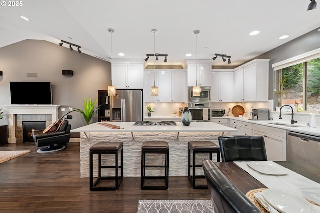 5309 NW 13th Cir, Camas, WA 98607 - kitchen featuring appliances with stainless steel finishes, a sink, white cabinetry, recessed lighting, and tasteful backsplash