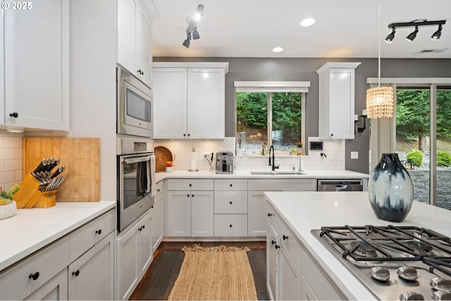5309 NW 13th Cir, Camas, WA 98607 - kitchen with appliances with stainless steel finishes, a sink, healthy amount of natural light, white cabinetry, and recessed lighting