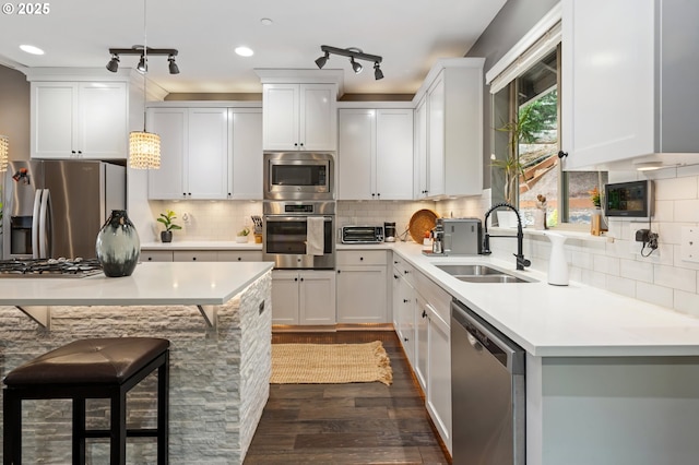 5309 NW 13th Cir, Camas, WA 98607 - kitchen with appliances with stainless steel finishes, a sink, dark wood finished floors, tasteful backsplash, and recessed lighting