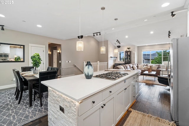 5309 NW 13th Cir, Camas, WA 98607 - kitchen featuring appliances with stainless steel finishes, dark wood-style flooring, a center island, white cabinetry, and recessed lighting