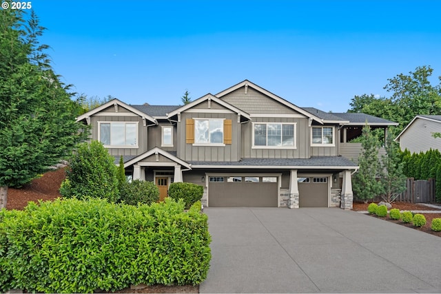 5309 NW 13th Cir, Camas, WA 98607 - craftsman-style house featuring board and batten siding, concrete driveway, an attached garage, and stone siding