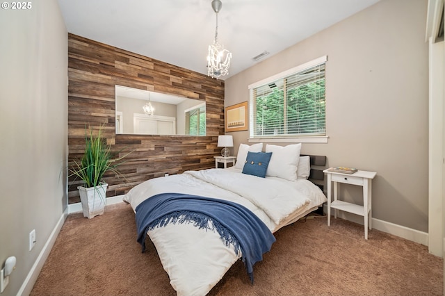 5309 NW 13th Cir, Camas, WA 98607 - bedroom with a chandelier, wood walls, carpet floors, and baseboards