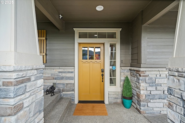 5309 NW 13th Cir, Camas, WA 98607 - doorway to property with a security system and stone siding