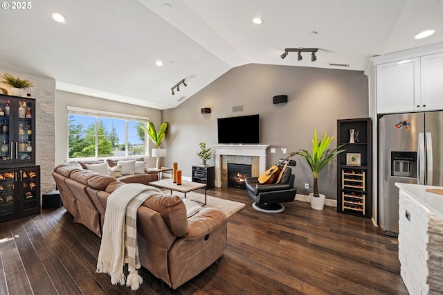 5309 NW 13th Cir, Camas, WA 98607 - living area featuring a fireplace, vaulted ceiling, dark wood finished floors, recessed lighting, and baseboards