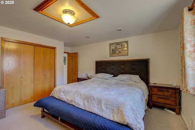 carpeted bedroom featuring a closet