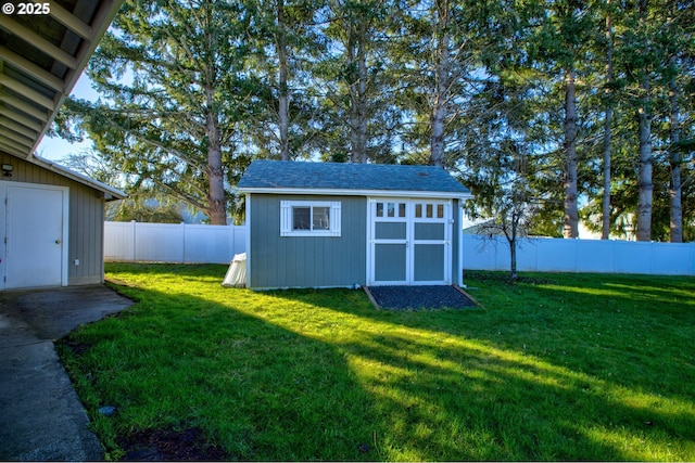 view of outbuilding with a yard