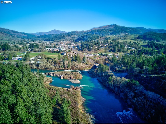 bird's eye view featuring a water and mountain view