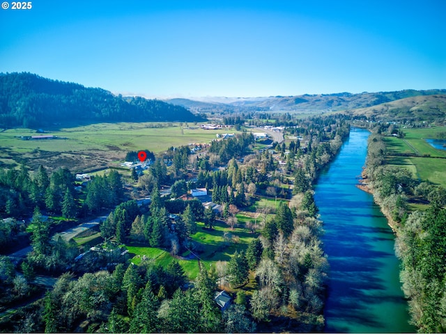 birds eye view of property featuring a water and mountain view