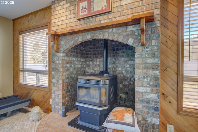 interior details with a wood stove and wooden walls