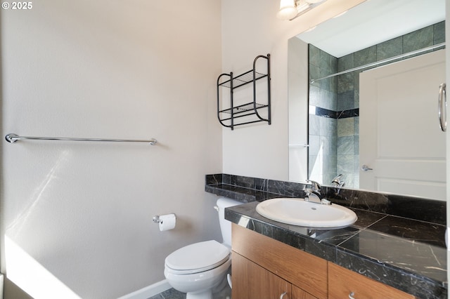 8712 N Decatur St Unit 302, Portland, OR 97203 - full bath with toilet, vanity, a shower, and baseboards
