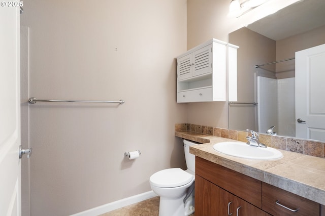 8712 N Decatur St Unit 302, Portland, OR 97203 - bathroom with baseboards, vanity, toilet, a shower, and tile patterned flooring