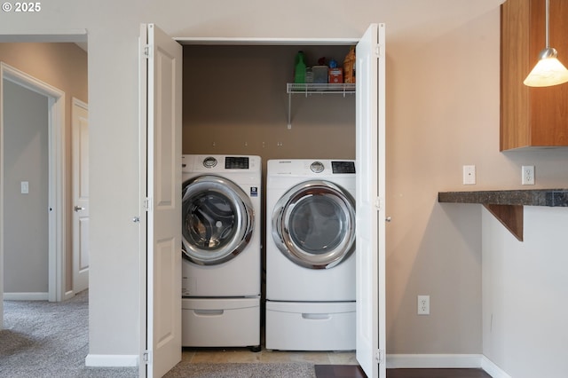 8712 N Decatur St Unit 302, Portland, OR 97203 - clothes washing area with washing machine and dryer and baseboards