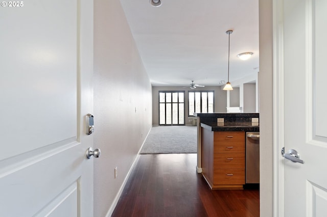 8712 N Decatur St Unit 302, Portland, OR 97203 - corridor with dark wood-style floors and baseboards