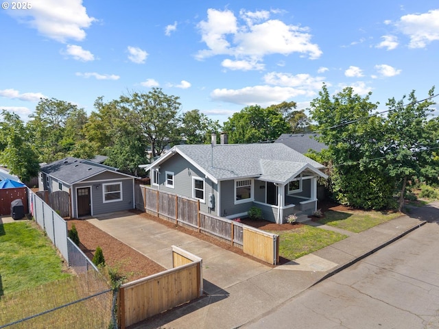 8316 SE Raymond Ct, Portland, OR 97266 - bungalow-style home featuring a fenced front yard, concrete driveway, and roof with shingles