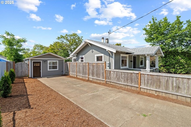 8316 SE Raymond Ct, Portland, OR 97266 - rear view of house featuring a fenced front yard and concrete driveway