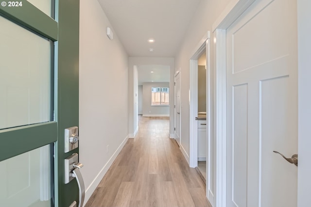 corridor featuring light hardwood / wood-style floors