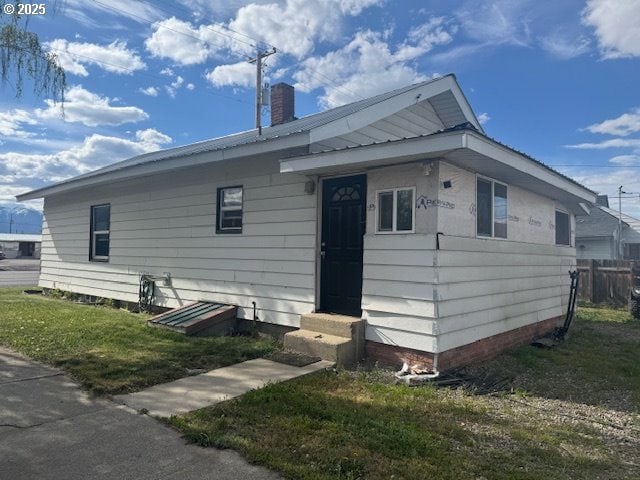 2800 10th St, Baker City, OR 97814 - rear view of house with entry steps and a chimney