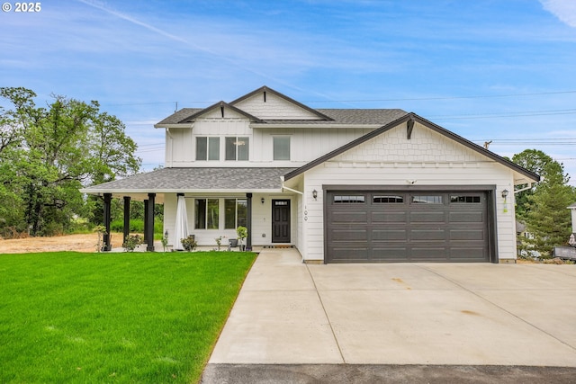 100 Running Dogs Ln, Saint Helens, OR 97051 - view of front facade featuring a shingled roof, a front yard, an attached garage, and concrete driveway