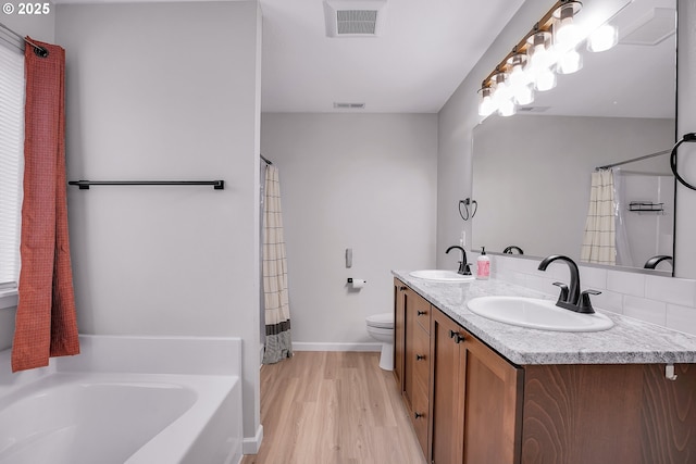 100 Running Dogs Ln, Saint Helens, OR 97051 - full bath featuring a bath, double vanity, toilet, wood finished floors, and baseboards