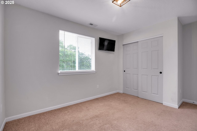 100 Running Dogs Ln, Saint Helens, OR 97051 - unfurnished bedroom featuring carpet floors, a closet, and baseboards