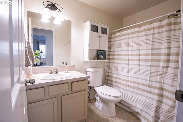 full bathroom with tile patterned flooring, a shower with shower curtain, toilet, and vanity