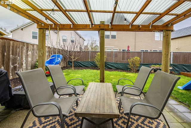 view of patio with outdoor dining area and a fenced backyard