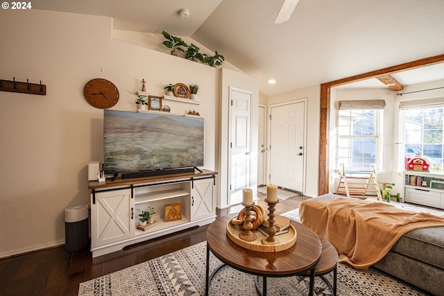 living room with dark wood-style flooring, baseboards, and vaulted ceiling