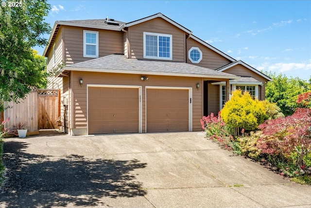 5249 NW 173rd Pl, Portland, OR 97229 - traditional home with an attached garage, concrete driveway, and roof with shingles