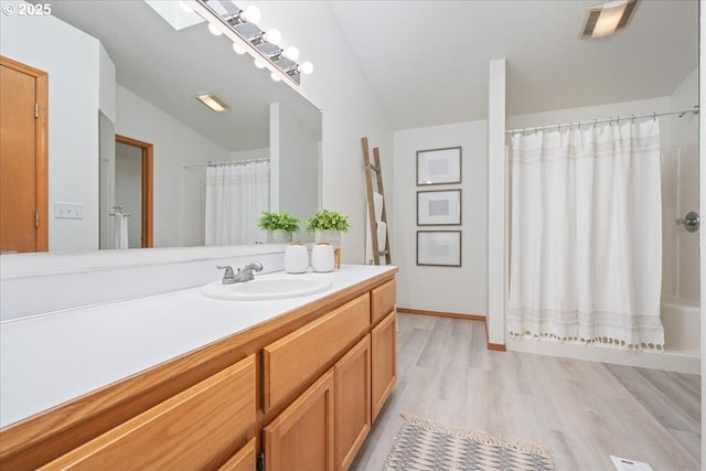 5249 NW 173rd Pl, Portland, OR 97229 - full bathroom with vanity and wood finished floors