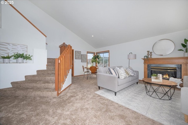 5249 NW 173rd Pl, Portland, OR 97229 - carpeted living area with stairs, a premium fireplace, and high vaulted ceiling