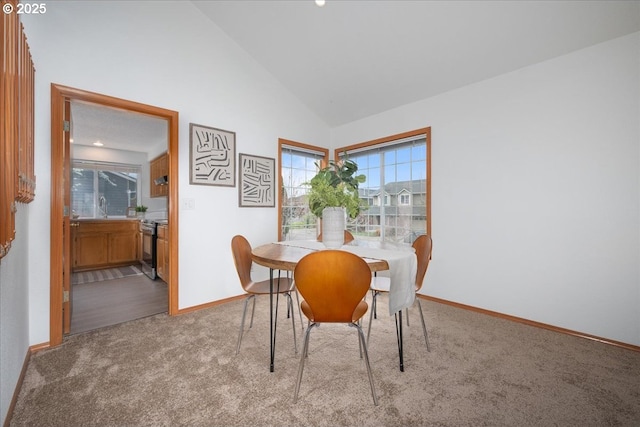 5249 NW 173rd Pl, Portland, OR 97229 - carpeted dining area with baseboards and high vaulted ceiling