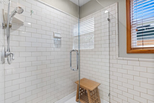 bathroom with a stall shower