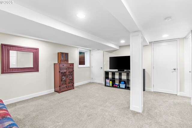 finished below grade area featuring carpet, baseboards, and recessed lighting