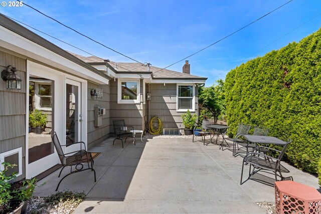 view of patio featuring outdoor dining area