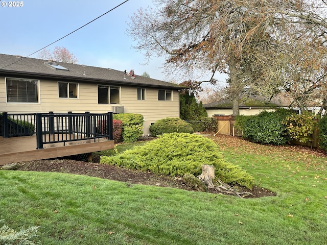 back of house featuring a wooden deck