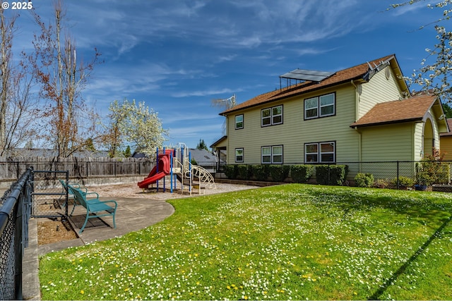 2000 S 8th St, Cottage Grove, OR 97424 - rear view of property with a playground and a shingled roof