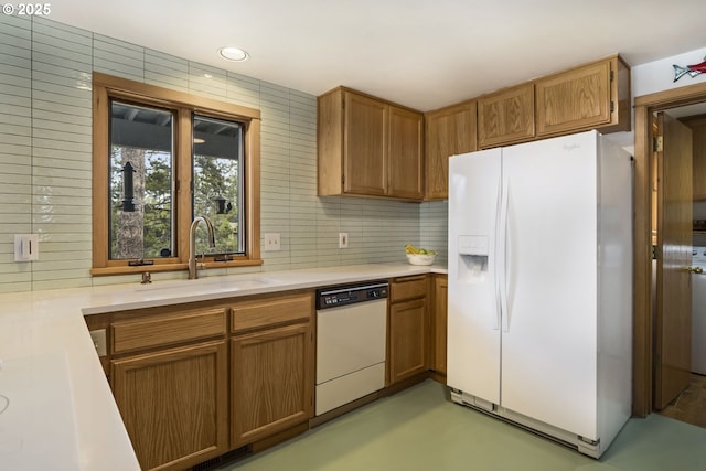 17692 Rogue Ln, Sunriver, OR 97707 - kitchen featuring white appliances, a sink, light countertops, brown cabinets, and recessed lighting