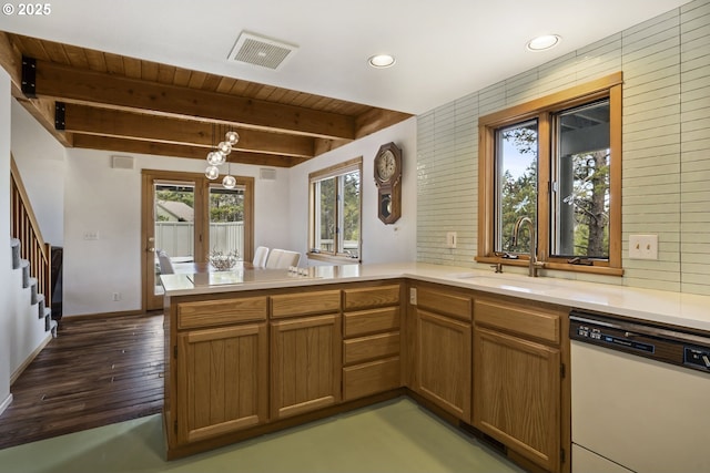 17692 Rogue Ln, Sunriver, OR 97707 - kitchen with dishwasher, a peninsula, a sink, light countertops, and recessed lighting