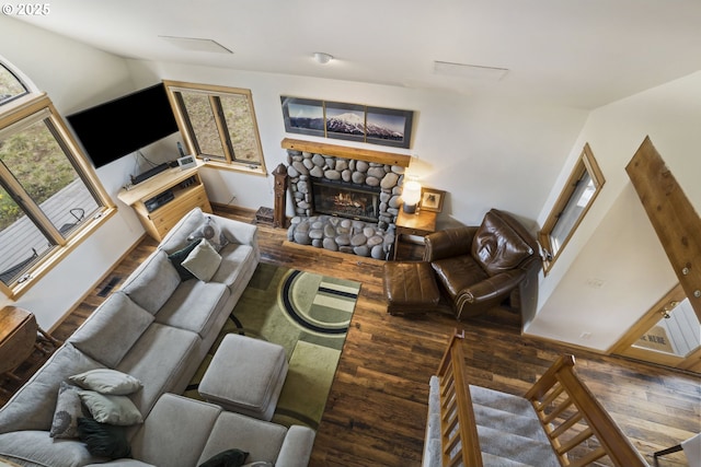 17692 Rogue Ln, Sunriver, OR 97707 - living room featuring hardwood / wood-style floors and a stone fireplace