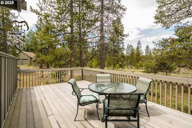 17692 Rogue Ln, Sunriver, OR 97707 - wooden deck with outdoor dining area