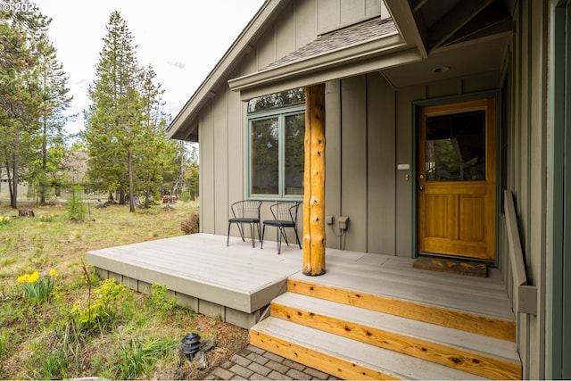 17692 Rogue Ln, Sunriver, OR 97707 - doorway to property with board and batten siding and a wooden deck