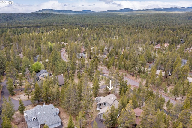 17692 Rogue Ln, Sunriver, OR 97707 - aerial overview of property's location with a heavily wooded area and mountains